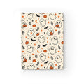 Ditsy Ghost journal with cute kawaii ghosts holding jack-o'-lanterns, orange pumpkins, black bats, hearts, moons and stars on a cream hardcover