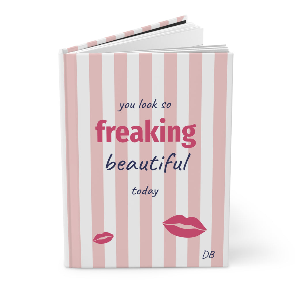 Freaking Beautiful pink striped hardcover journal standing upright with red lips and initials