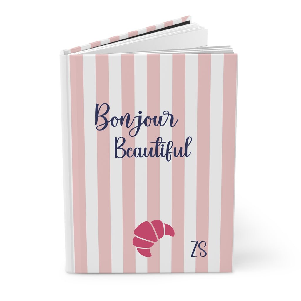Bonjour Beautiful pink striped hardcover journal standing upright with croissant and initials