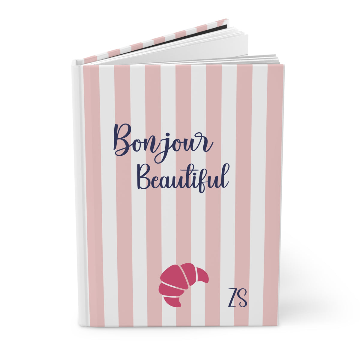 Bonjour Beautiful pink striped hardcover journal standing upright with croissant and initials