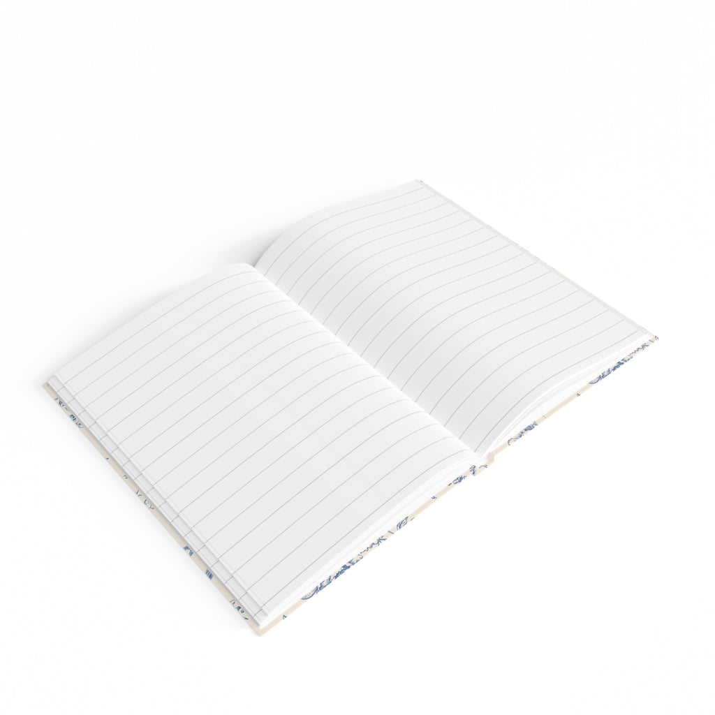 Toile de Jouy journal lying open, showing ruled pages and lay-flat casewrap binding
