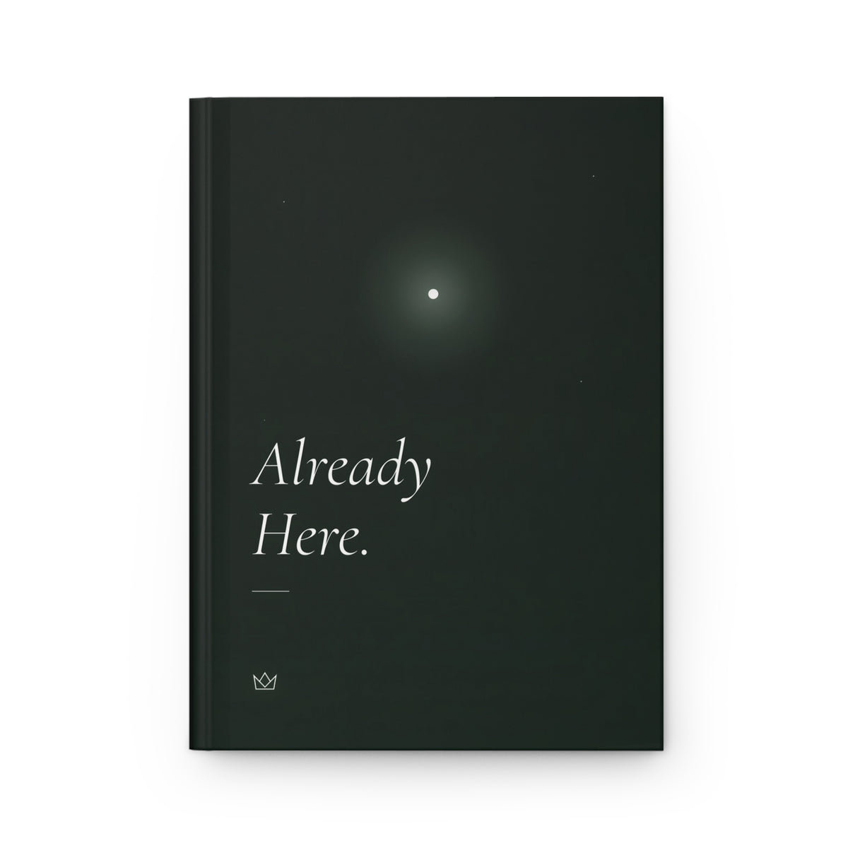 Front cover of the Already Here. manifestation journal: forest-green hardcover with a single glowing star and soft italic title