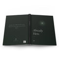 Already Here journal laid open to show the full-wrap design: the question on the back, FIELD NO. 03 on the dark spine, and the glowing star on the front
