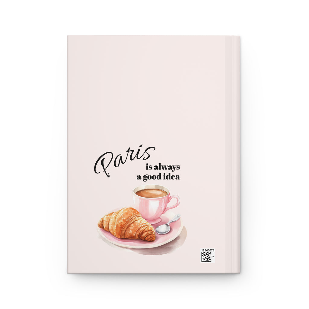 Close-up of blush pink Paris journal cover with Eiffel Tower watercolor illustration