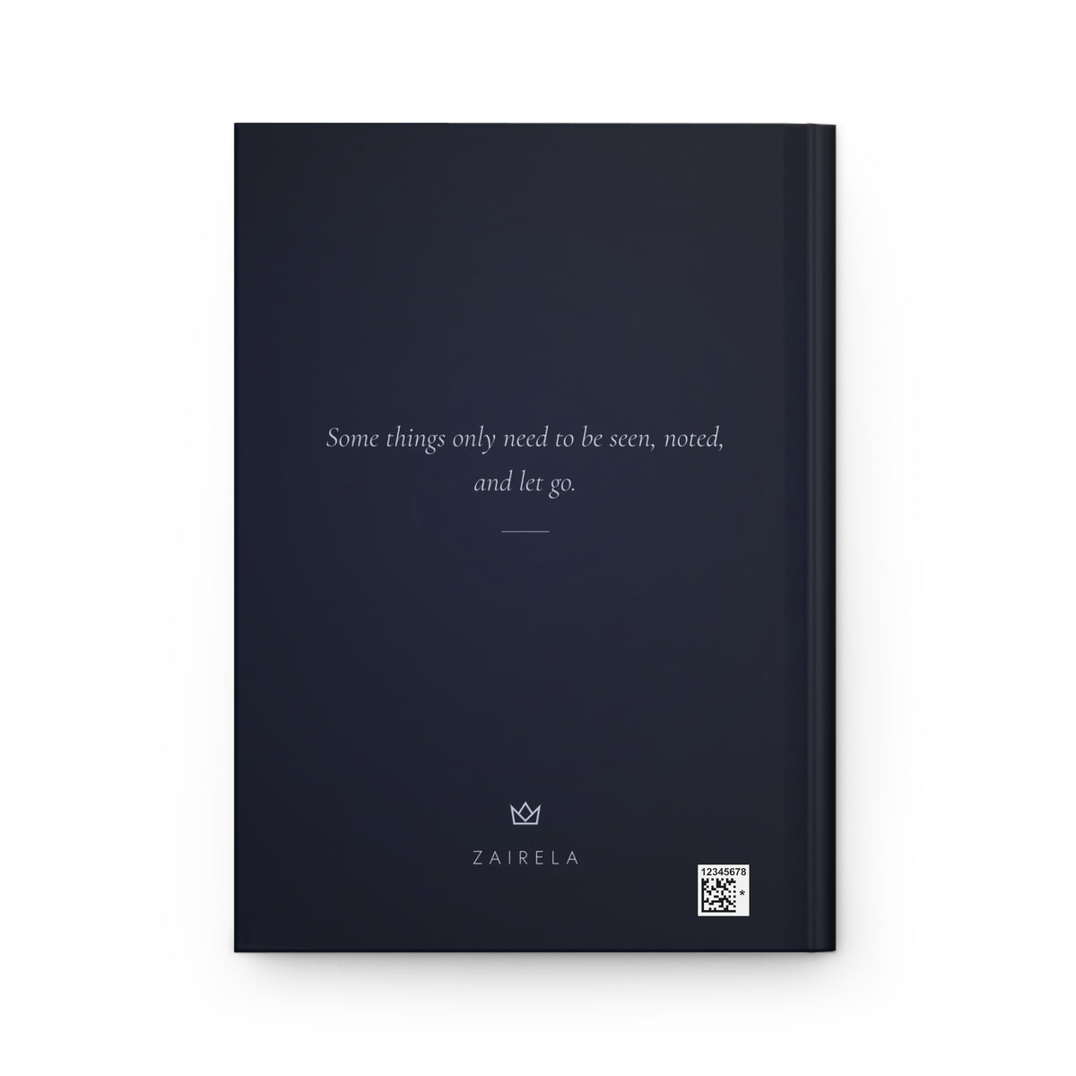 Back cover of the night-blue journal with the italic line Some things only need to be seen, noted, and let go., plus a small production barcode