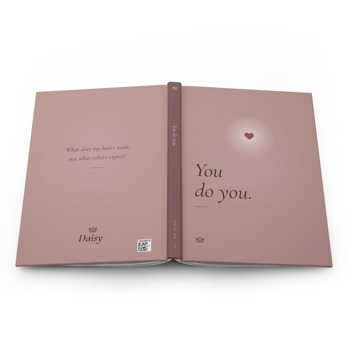 You Do You journal laid open flat, showing the full wraparound dusty rose cover: back with a personalized name, spine with FIELD NO. 12, and front with a glowing heart